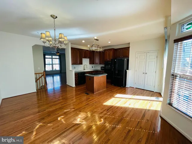 a view of a kitchen and dining room