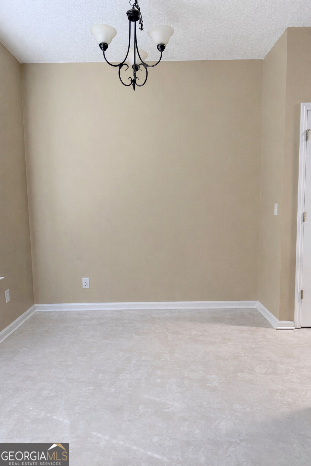 7759 Bucknell Terrace Fairburn, GA 30213 - Photo 11 of 26 a view of a room with rack on the wall