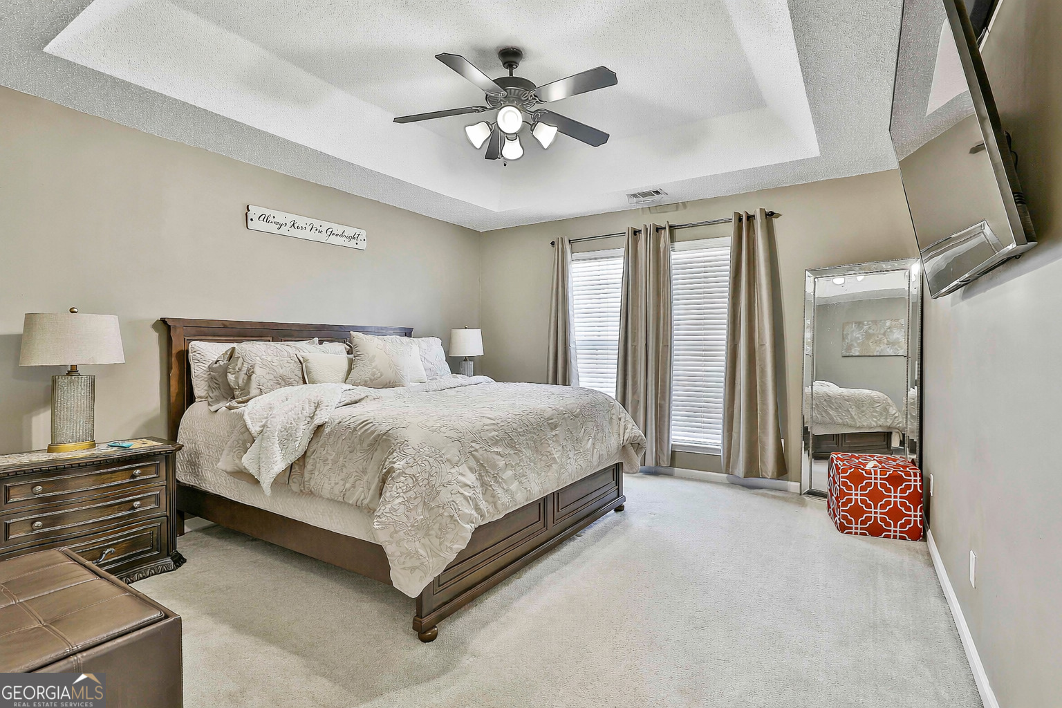 7759 Bucknell Terrace Fairburn, GA 30213 - Photo 13 of 26 a spacious bedroom with a bed and a chandelier