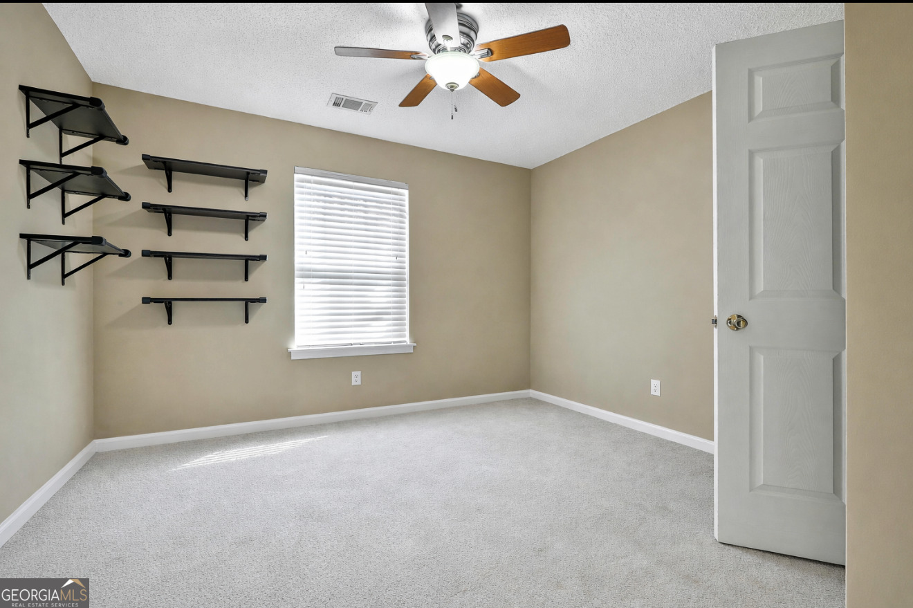 7759 Bucknell Terrace Fairburn, GA 30213 - Photo 18 of 26 a view of an empty room with a window