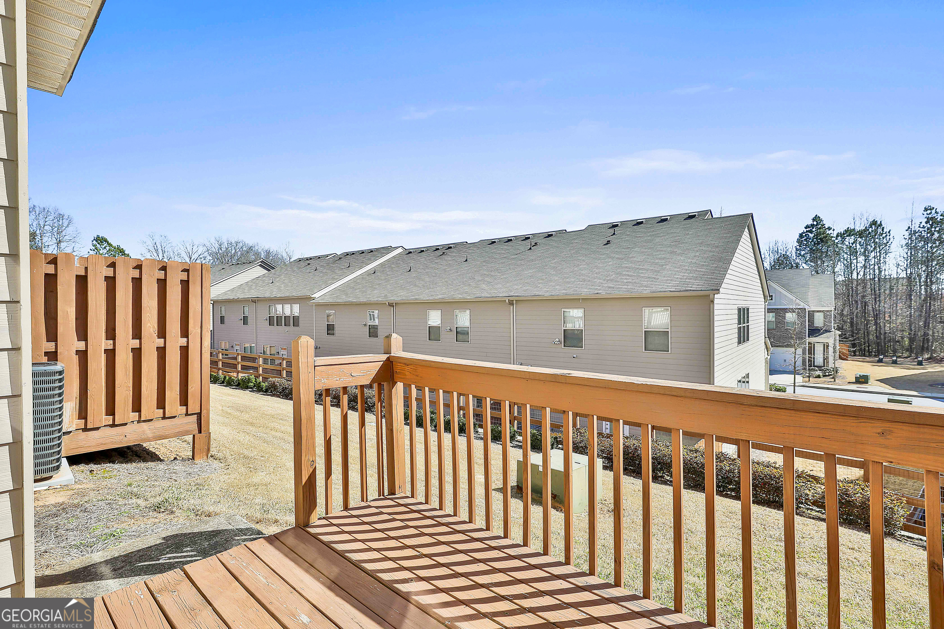 7759 Bucknell Terrace Fairburn, GA 30213 - Photo 20 of 26 a view of a house with wooden fence