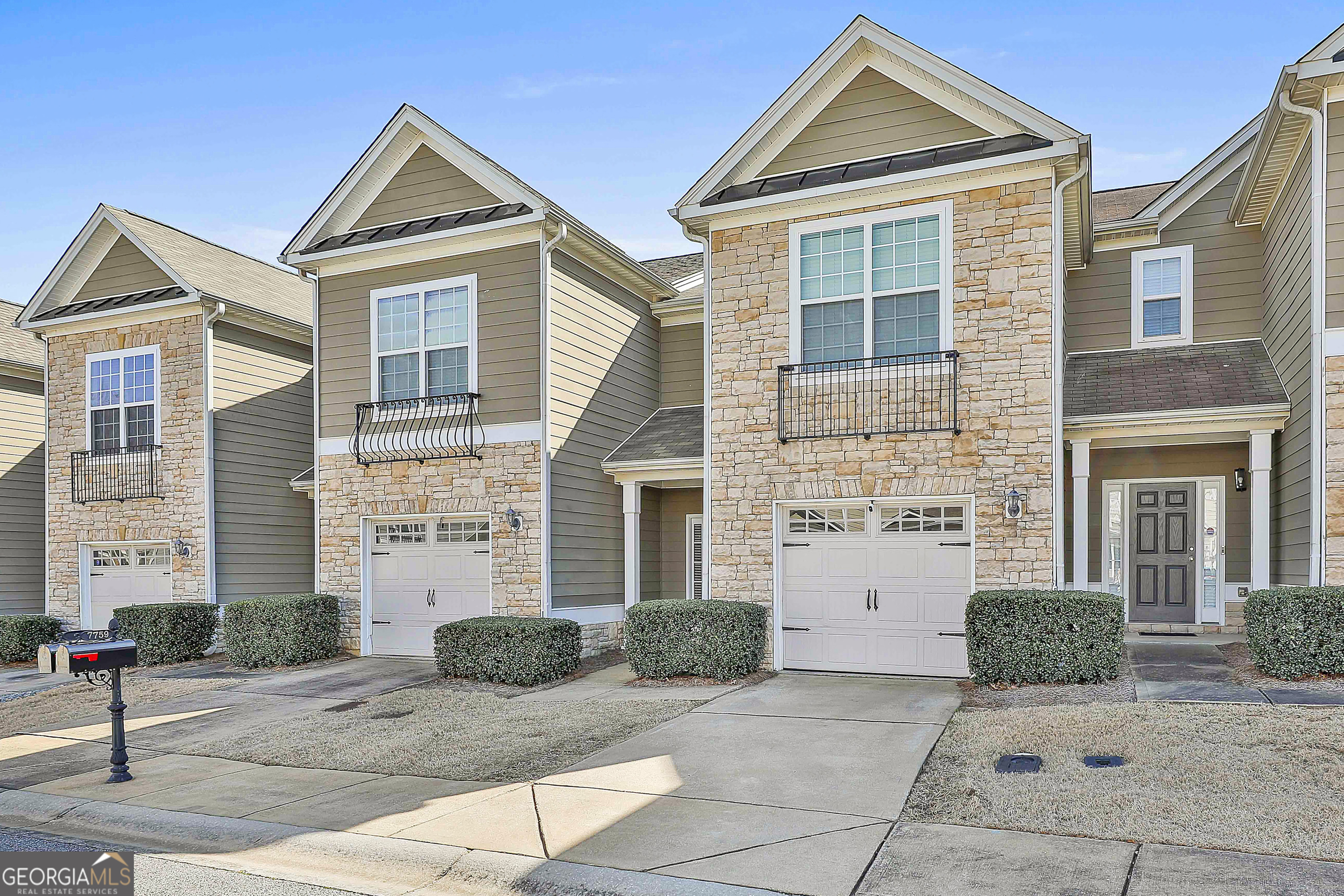 7759 Bucknell Terrace Fairburn, GA 30213 - Photo 2 of 26 a front view of a house with yard