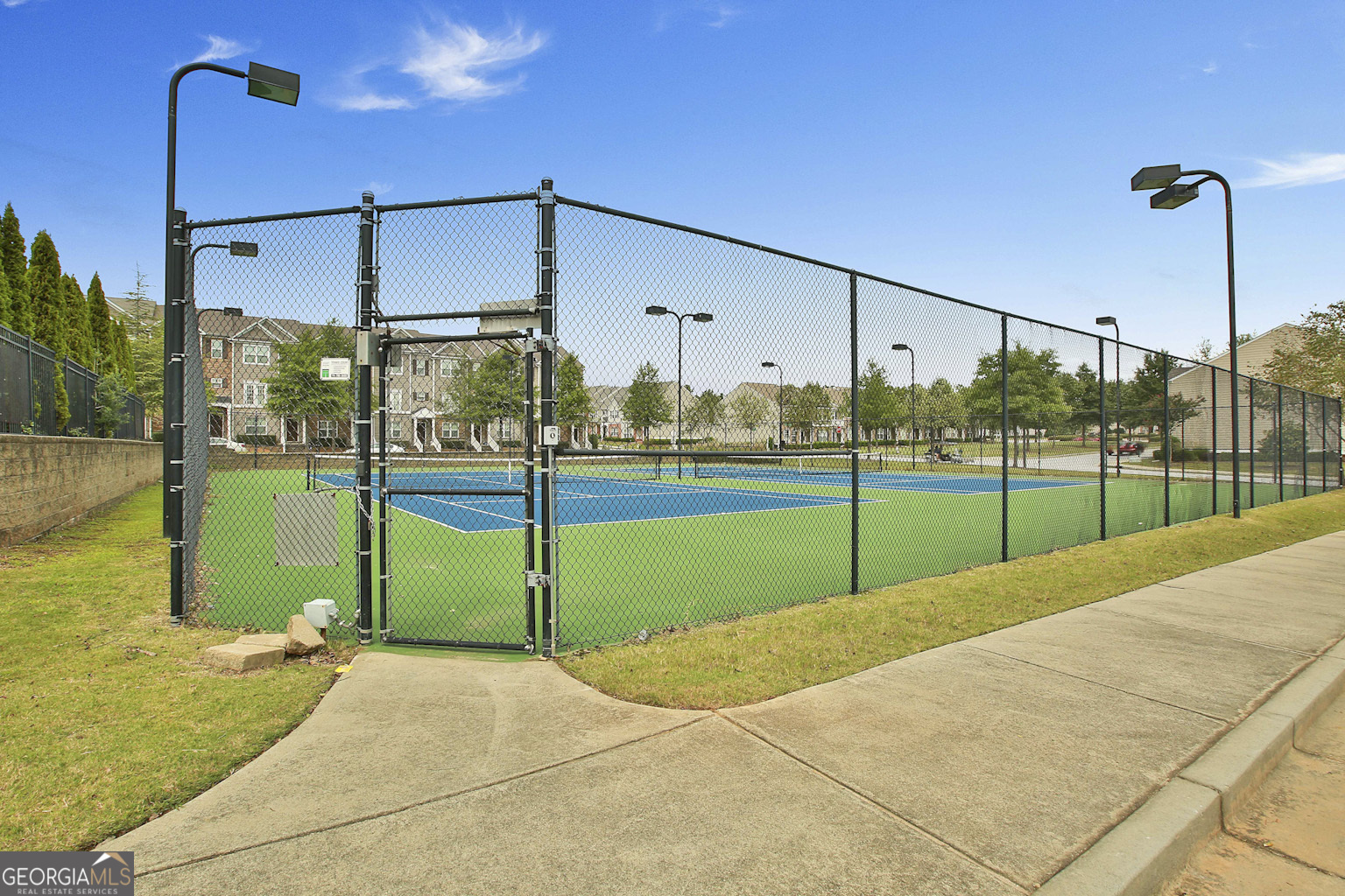 7759 Bucknell Terrace Fairburn, GA 30213 - Photo 24 of 26 a view of a house and a floor to ceiling window