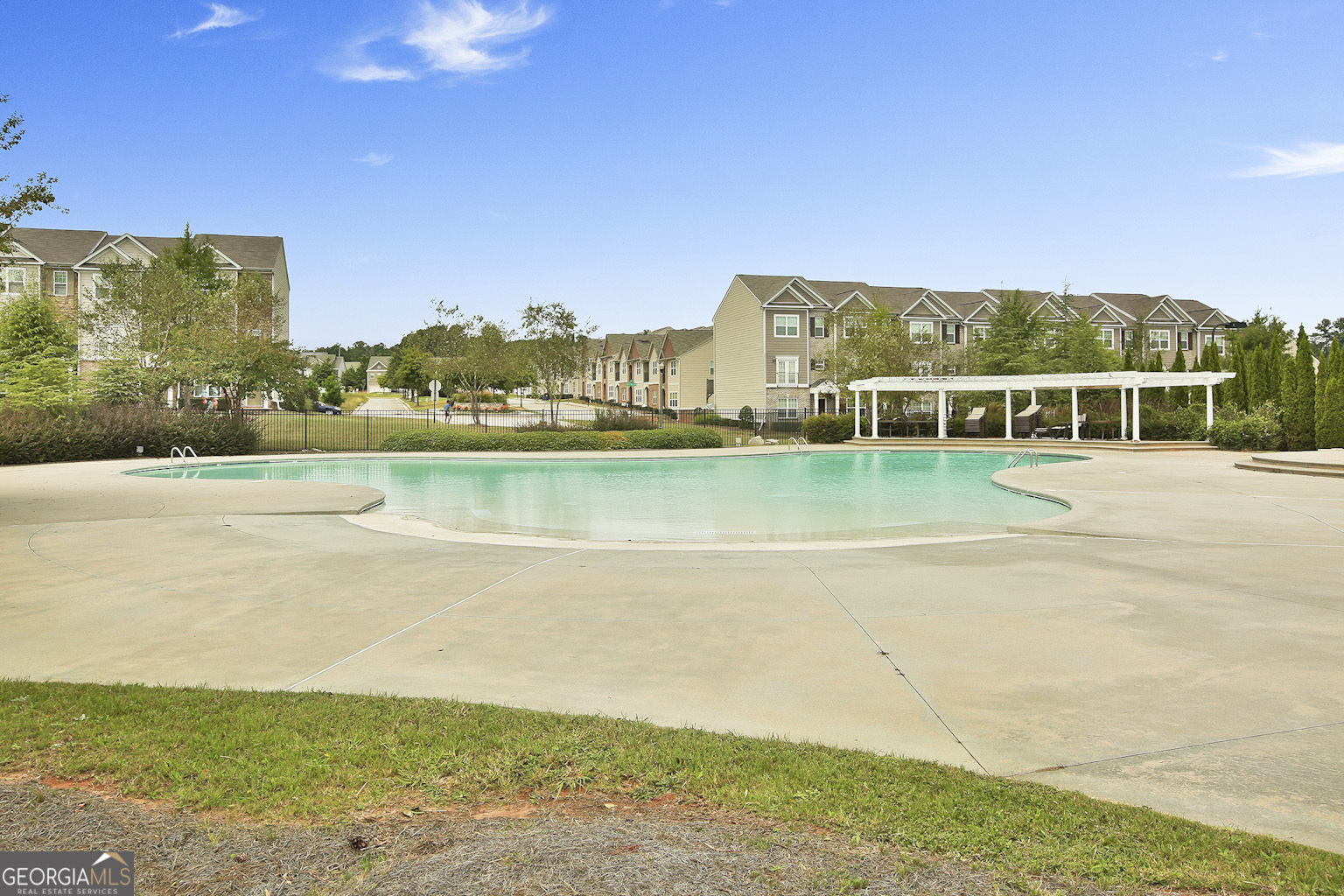 7759 Bucknell Terrace Fairburn, GA 30213 - Photo 25 of 26 a view of an ocean with a building in the background