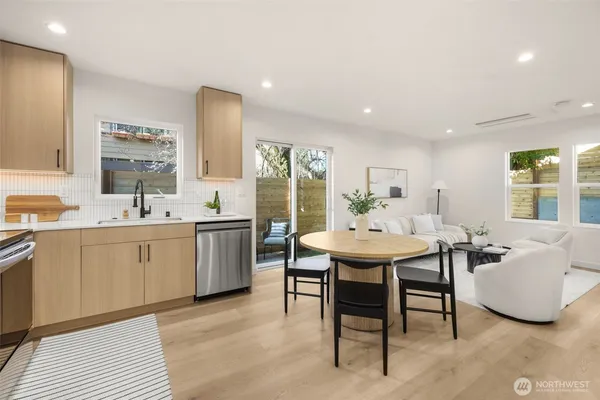 a kitchen with a sink and stove