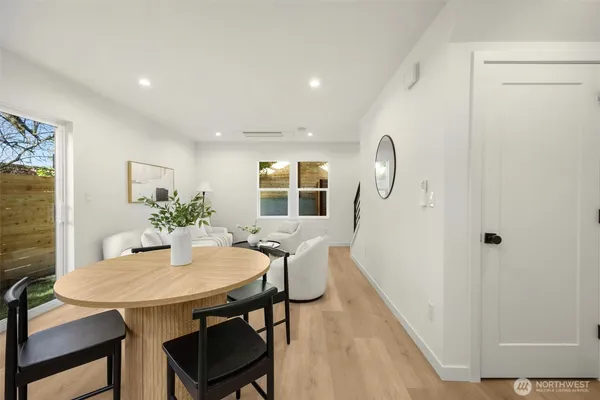 a view of a dining room with furniture and window