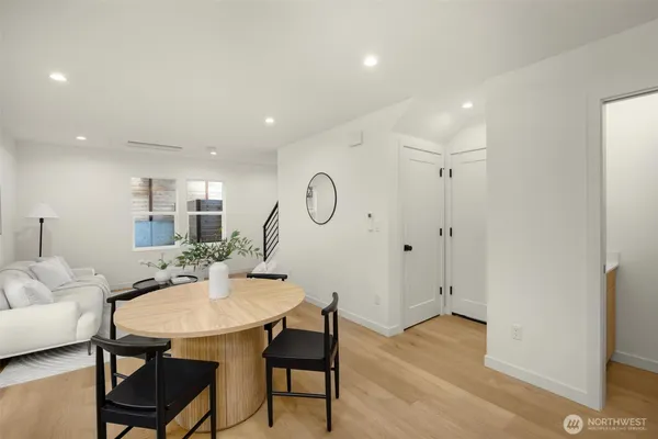 a view of a dining room with furniture and wooden floor