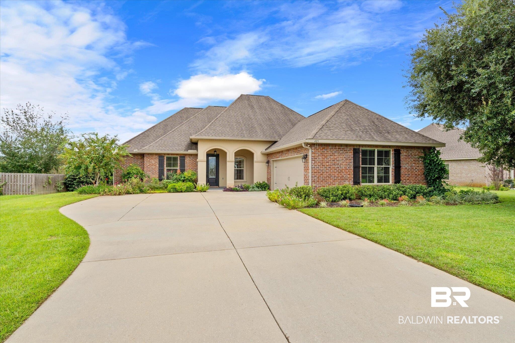423 Breckin Drive Fairhope, AL 36532 - Photo 30 of 31 View of front facade featuring a garage and a front yard