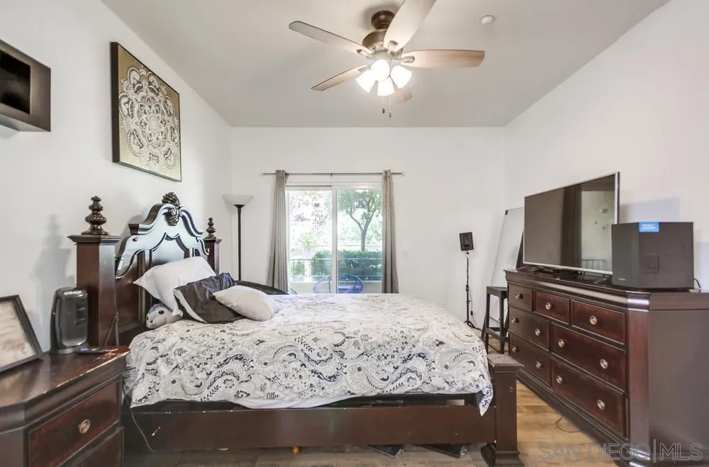 9728 Marilla Drive, Unit 312 Lakeside, CA 92040 - Photo 11 of 28 a bedroom with a bed and a flat screen tv