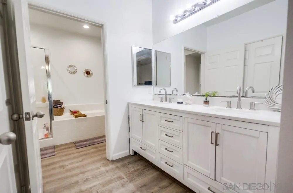 9728 Marilla Drive, Unit 312 Lakeside, CA 92040 - Photo 13 of 28 a bathroom with a double vanity sink mirror and double