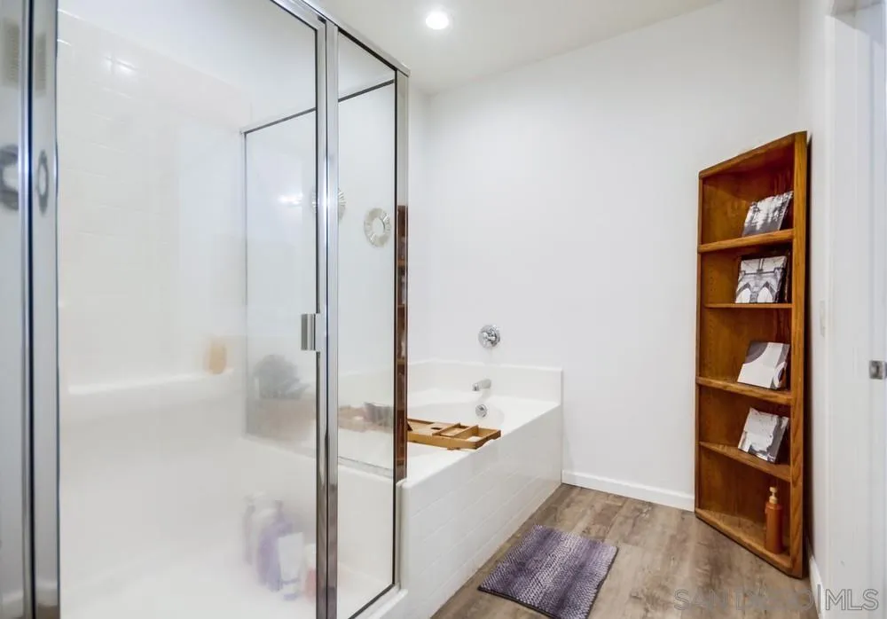 9728 Marilla Drive, Unit 312 Lakeside, CA 92040 - Photo 15 of 28 a bathroom with a tub and shower