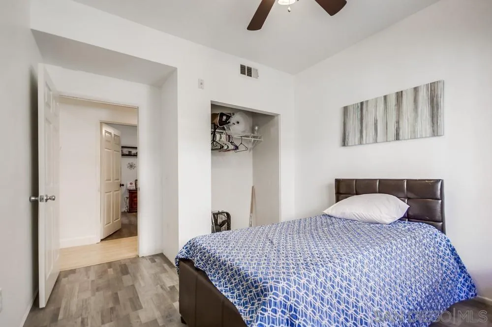 9728 Marilla Drive, Unit 312 Lakeside, CA 92040 - Photo 18 of 28 a bedroom with a bed and a couch