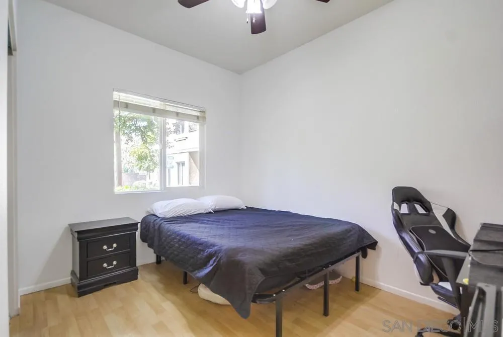 9728 Marilla Drive, Unit 312 Lakeside, CA 92040 - Photo 19 of 28 a bed sitting in a room next to a window