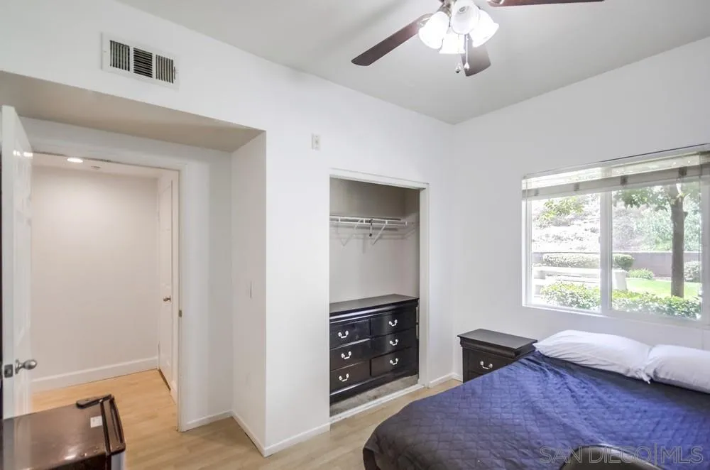 9728 Marilla Drive, Unit 312 Lakeside, CA 92040 - Photo 20 of 28 a bedroom with a bed and a television
