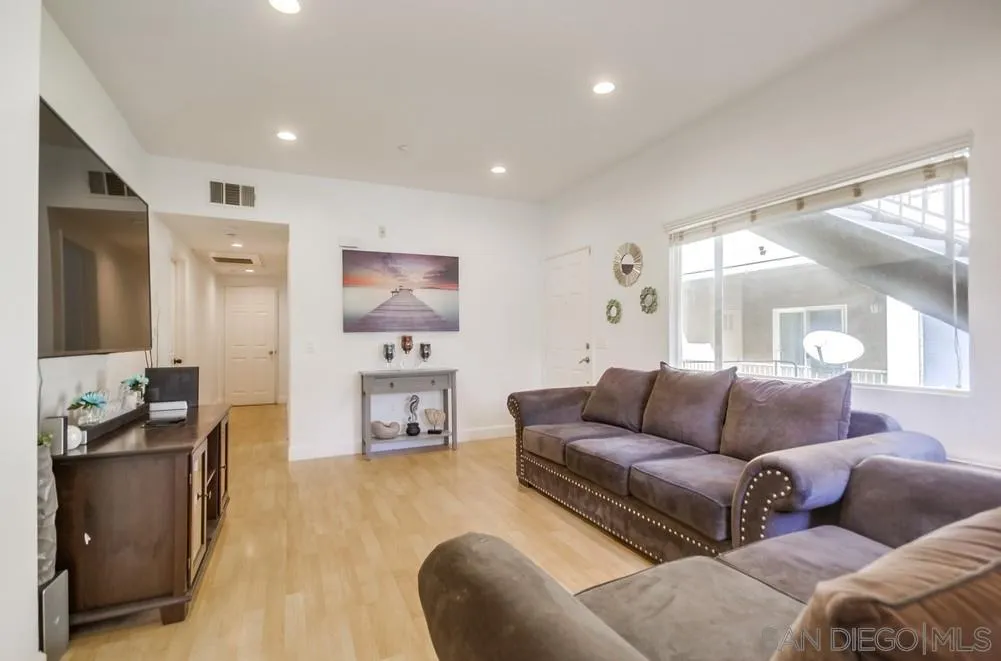 9728 Marilla Drive, Unit 312 Lakeside, CA 92040 - Photo 2 of 28 a living room with furniture and a flat screen tv