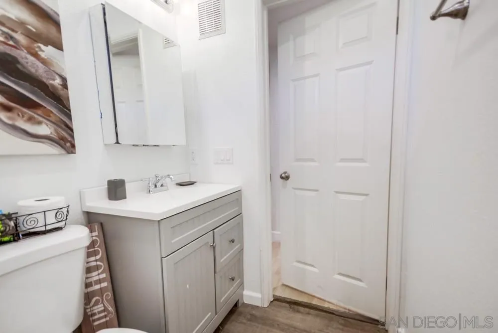 9728 Marilla Drive, Unit 312 Lakeside, CA 92040 - Photo 21 of 28 a utility room with cabinets washer and dryer