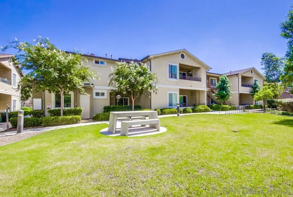 9728 Marilla Drive, Unit 312 Lakeside, CA 92040 - Photo 24 of 28 a view of a house with pool and a yard