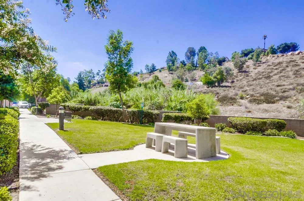9728 Marilla Drive, Unit 312 Lakeside, CA 92040 - Photo 25 of 28 a garden view with a seating space