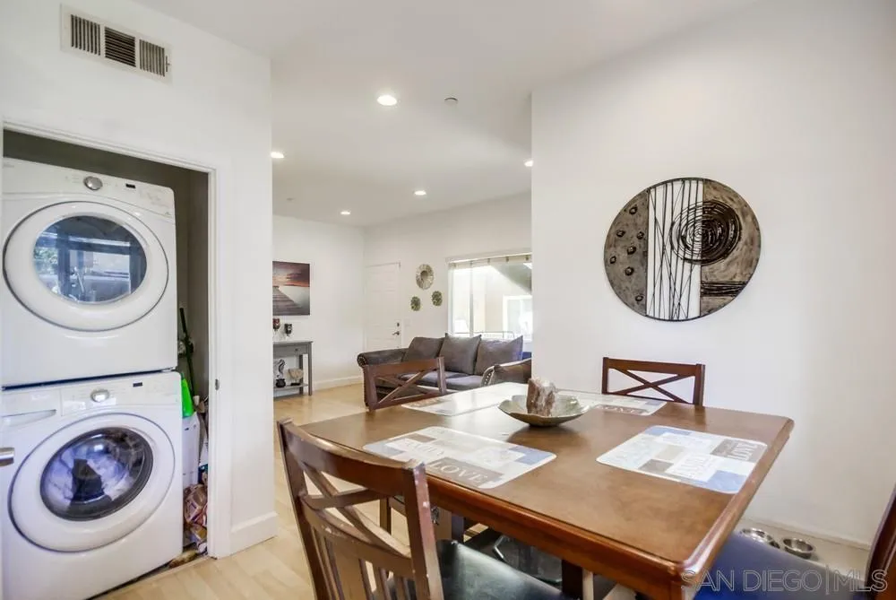 9728 Marilla Drive, Unit 312 Lakeside, CA 92040 - Photo 4 of 28 a view of a dining room with furniture and a chandelier