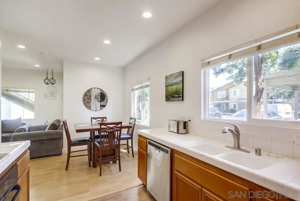 9728 Marilla Drive, Unit 312 Lakeside, CA 92040 - Photo 6 of 28 a view of dining table chairs and window