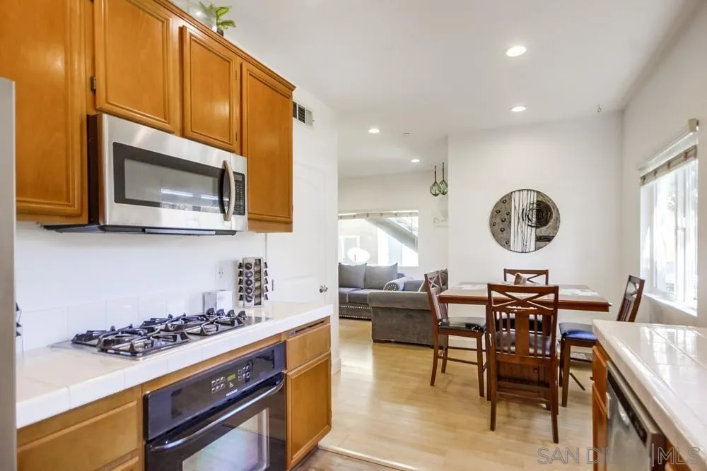 9728 Marilla Drive, Unit 312 Lakeside, CA 92040 - Photo 7 of 28 a kitchen with a table and chairs in it