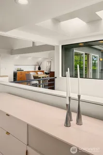 a view of kitchen with furniture and large window