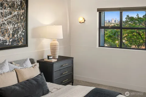 a bedroom with a bed and window