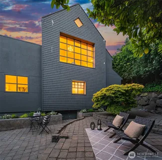 a brick building with a bench in front of it