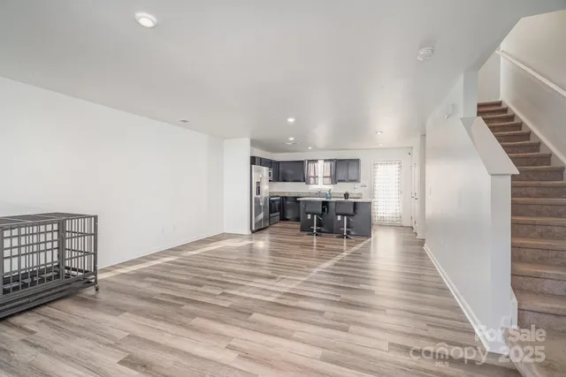 a view of kitchen and dining room with wooden floor