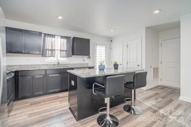 a kitchen with a sink cabinets and window