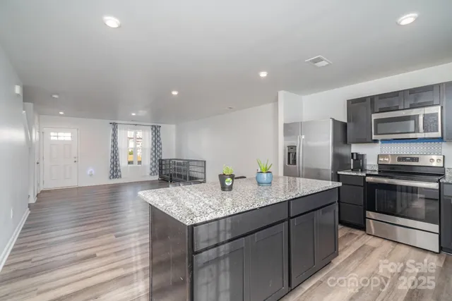 a kitchen with a stove and a sink