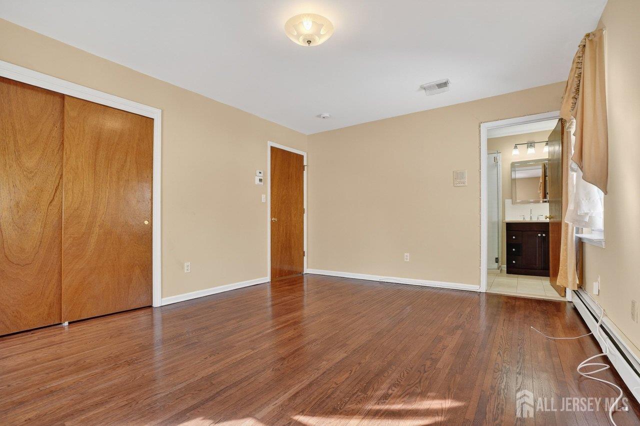 1 Wakefield Drive Edison, NJ 08820 - Photo 13 of 29 a view of a livingroom with wooden floor