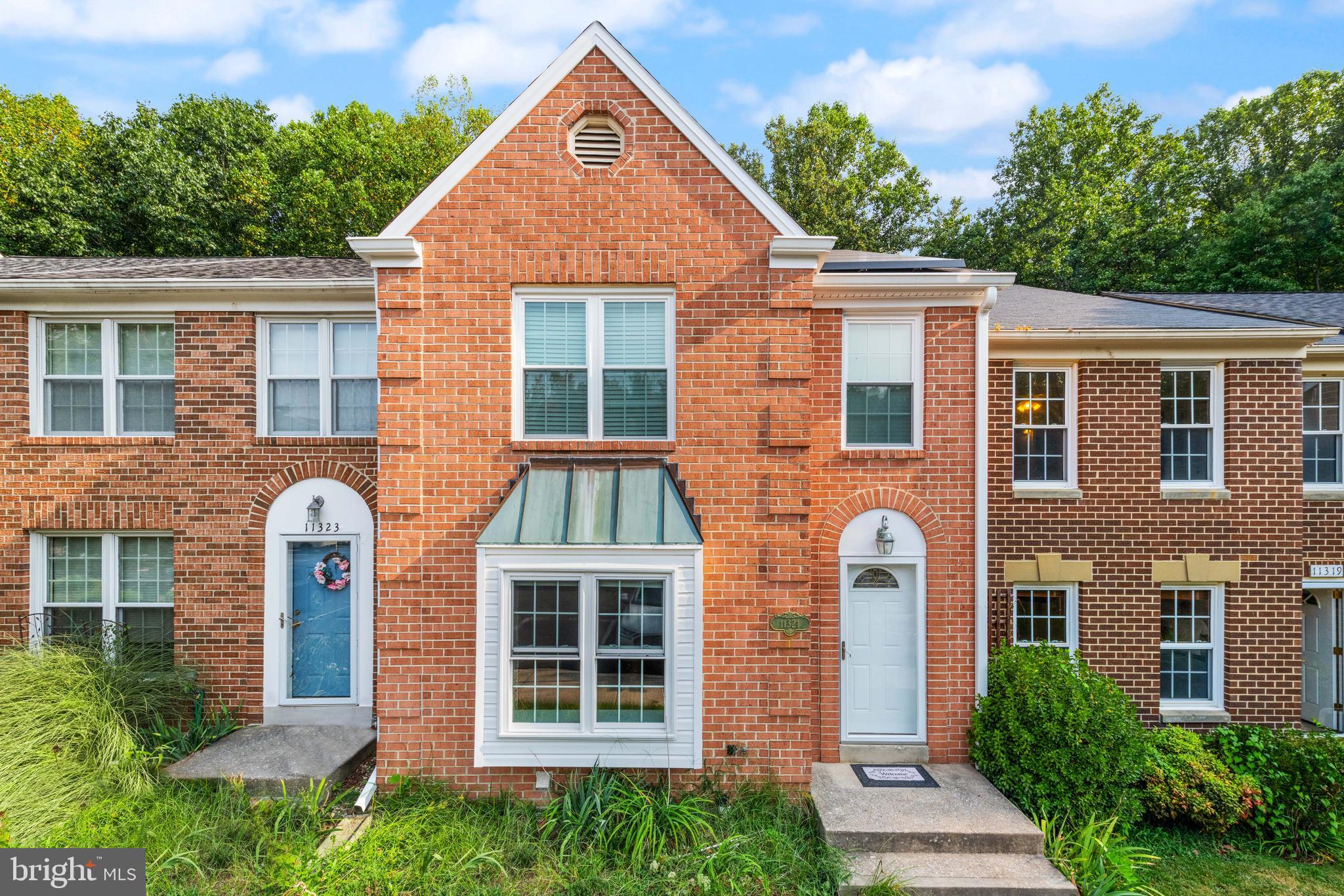 11321 Crescendo Place Silver Spring, MD 20901 - Photo 1 of 24 front view of a house with a yard