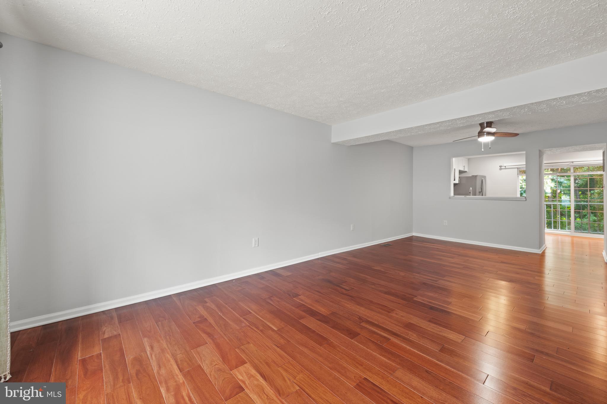 11321 Crescendo Place Silver Spring, MD 20901 - Photo 15 of 24 a view of empty room with wooden floor and fan