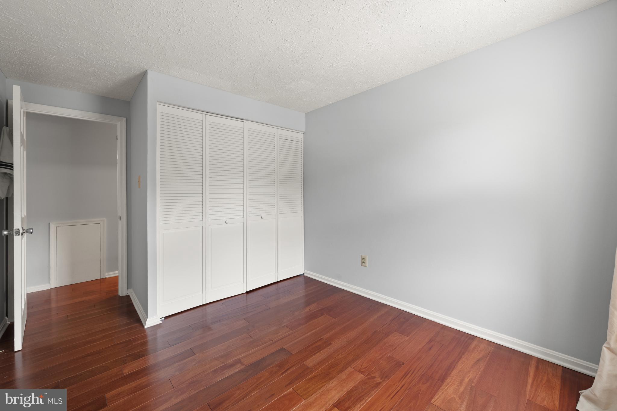 11321 Crescendo Place Silver Spring, MD 20901 - Photo 17 of 24 a view of an empty room with wooden floor