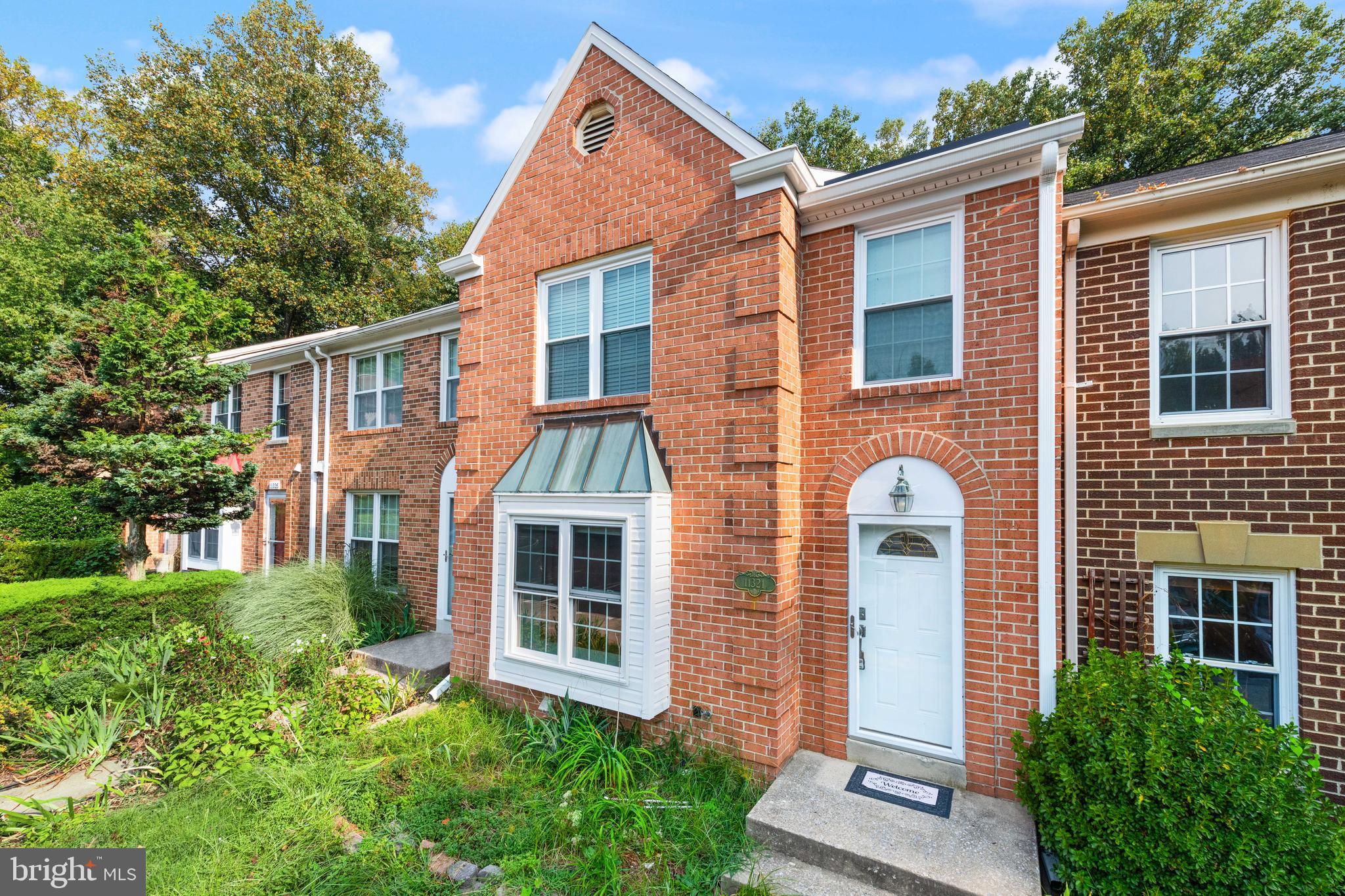11321 Crescendo Place Silver Spring, MD 20901 - Photo 2 of 24 a view of a house with a yard and plants
