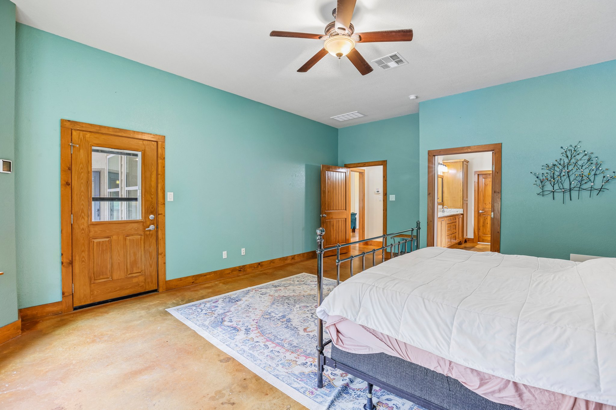 267 Corral Road Smithville, TX 78957 - Photo 29 of 40 Expansive room featuring stained concrete flooring and a ceiling fan with integrated lighting