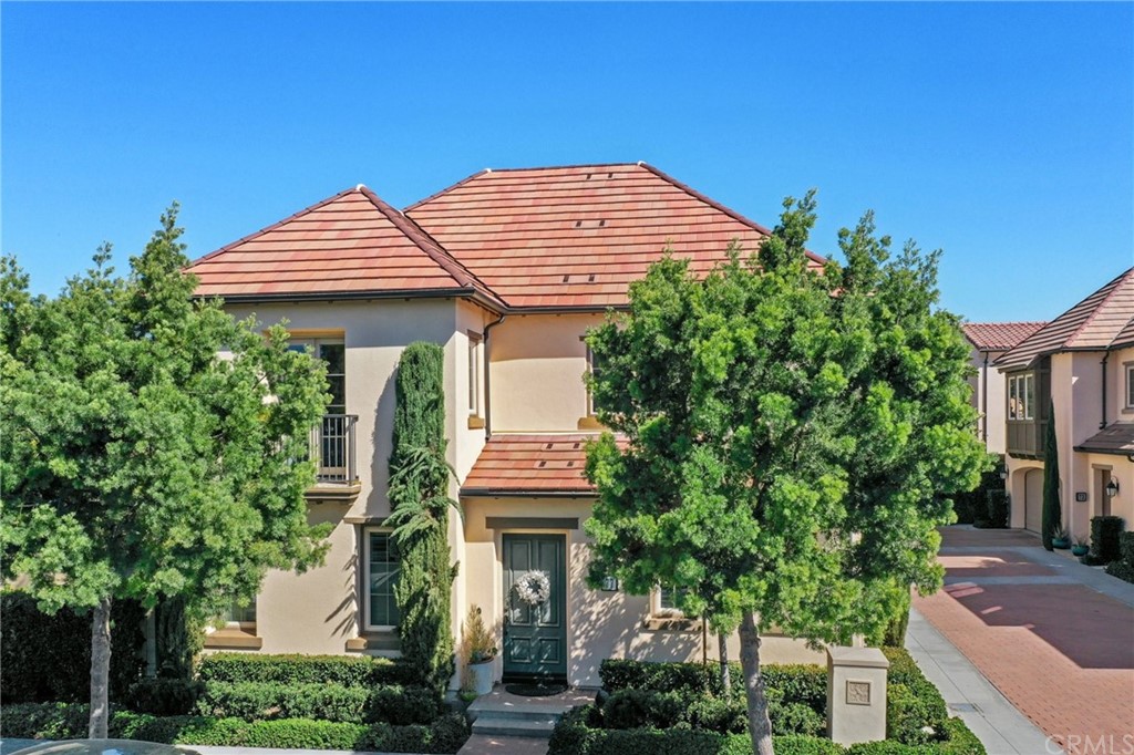 77 Cactus Flower Irvine, CA 92620 - Photo 1 of 1 a front view of a house with a garden