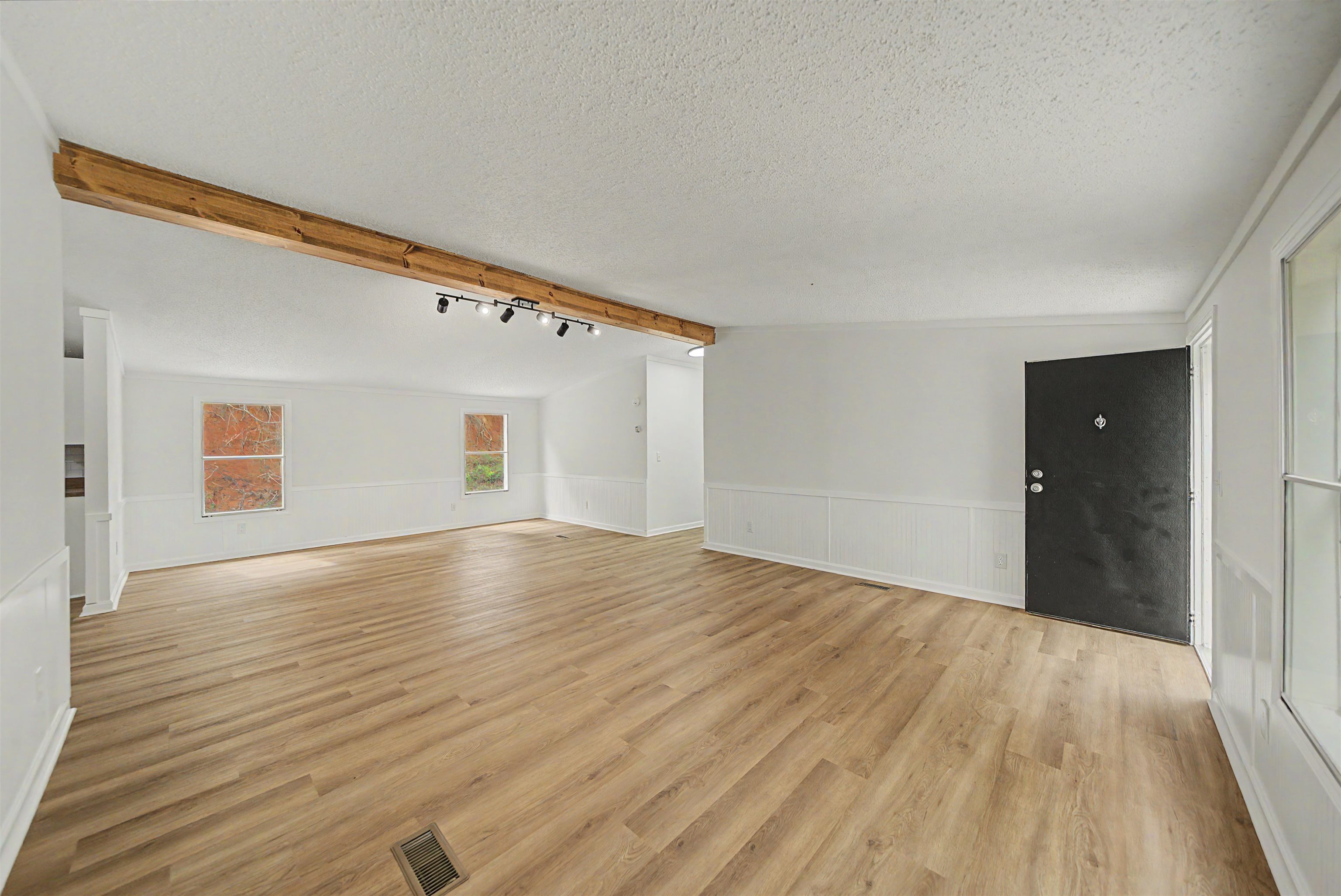 890 Burks Road Savannah, TN 38372 - Photo 6 of 40 a view of an empty room with wooden floor