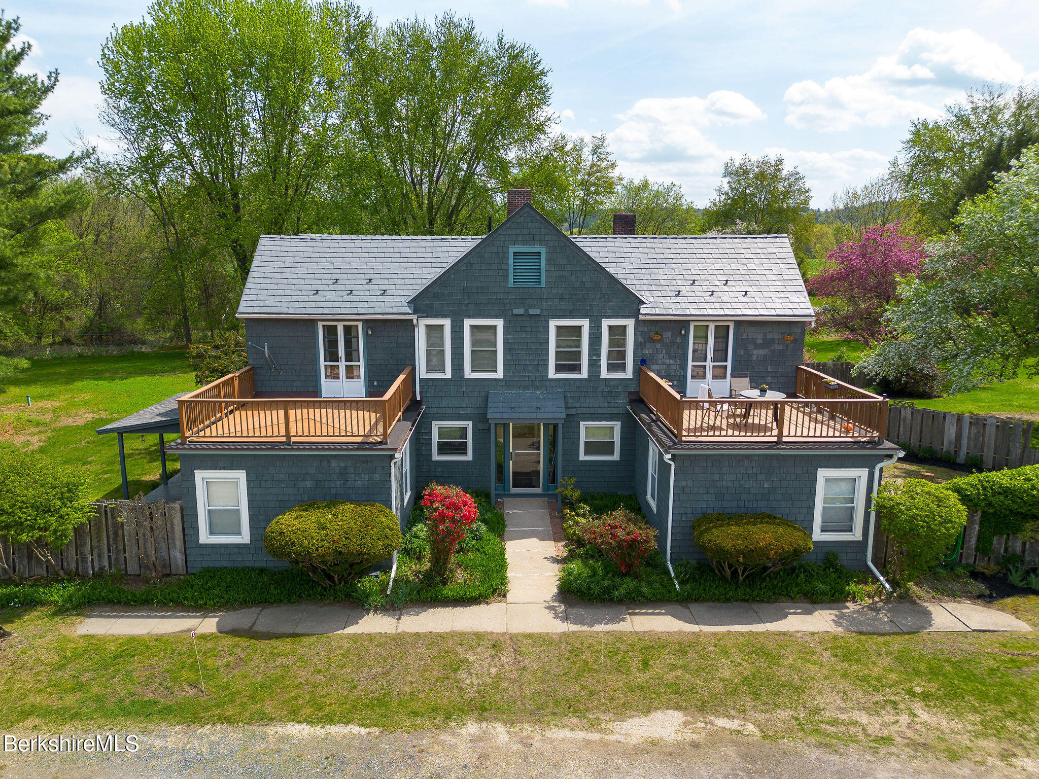 567 South Main Street Sheffield, MA 01257 - Photo 2 of 70 a front view of a house with a yard and garage