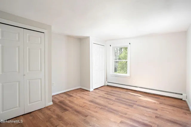 a kitchen with a white cabinets and white appliances