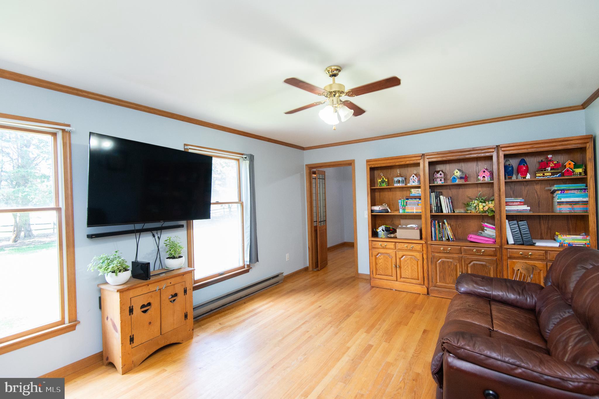 9472 Quail Run Road Denton, MD 21629 - Photo 9 of 50 a living room with furniture and a flat screen tv