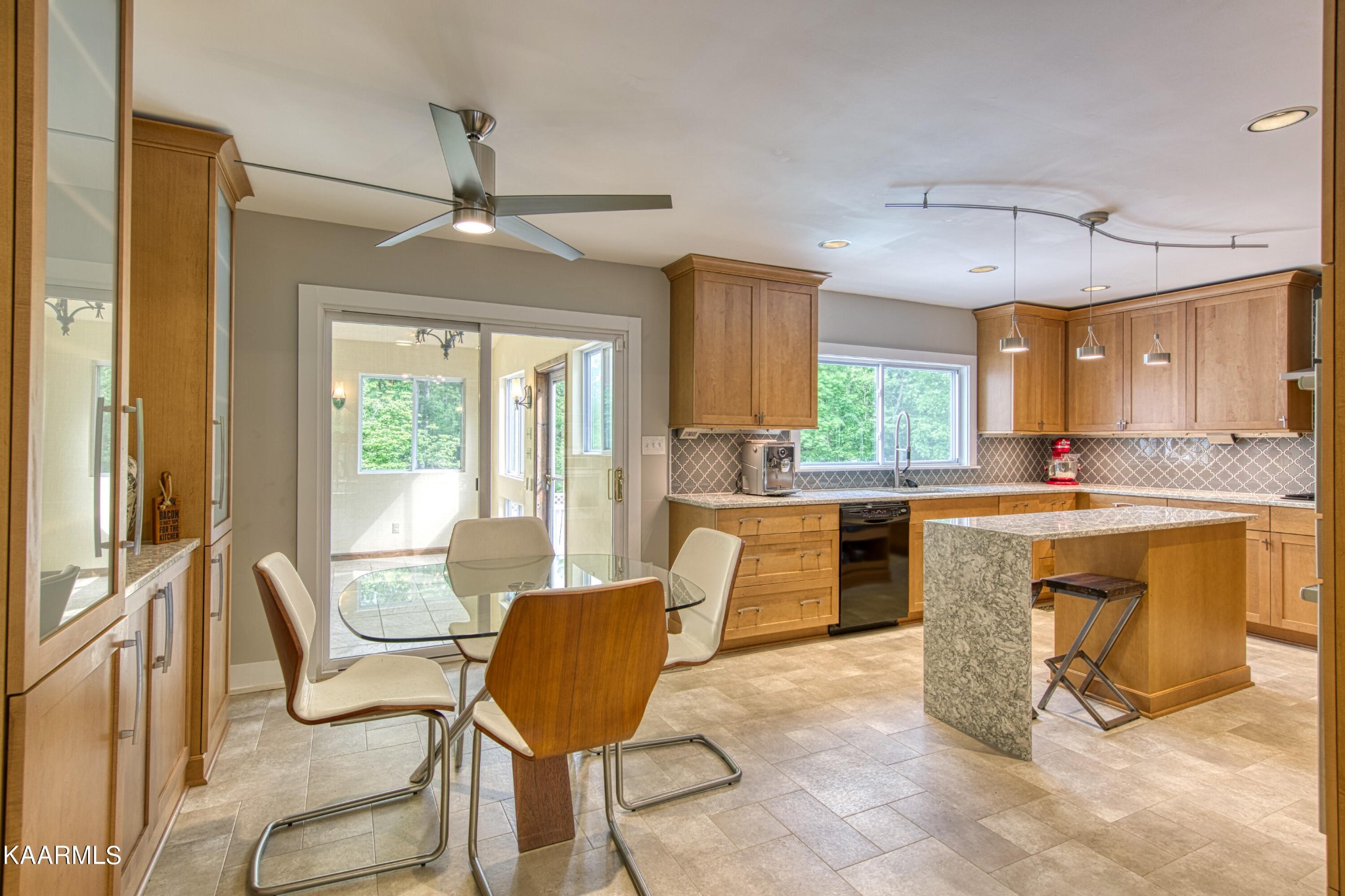 2313 Tooles Bend Road Knoxville, TN 37922 - Photo 13 of 50 a kitchen with granite countertop a stove a sink a dining table and chairs