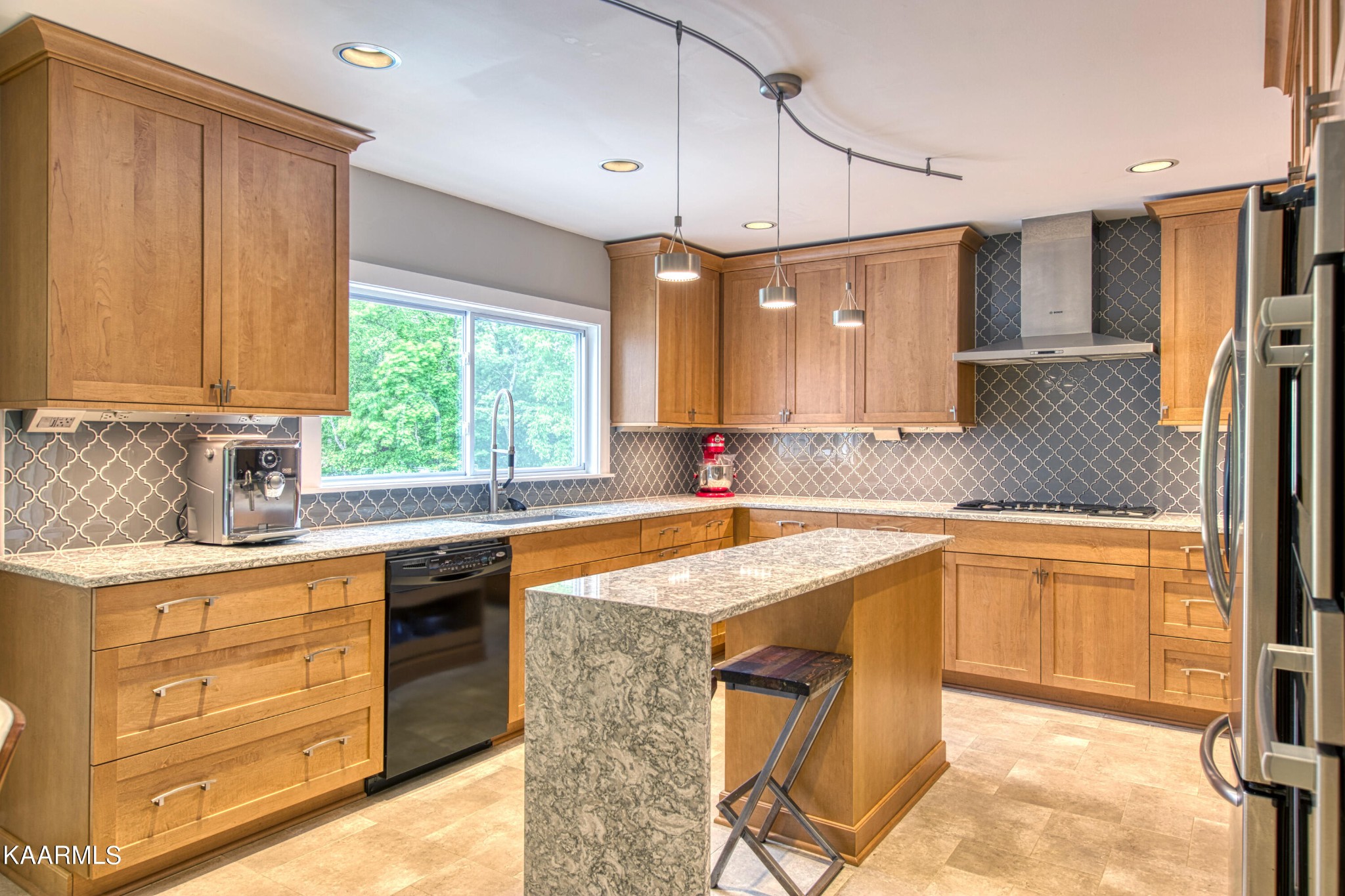 2313 Tooles Bend Road Knoxville, TN 37922 - Photo 15 of 50 a kitchen with stainless steel appliances granite countertop a sink stove and refrigerator