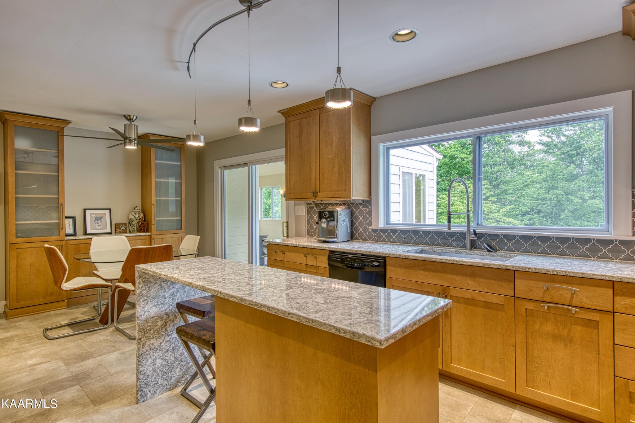 2313 Tooles Bend Road Knoxville, TN 37922 - Photo 17 of 50 a large kitchen with kitchen island granite countertop a sink a stove and a refrigerator