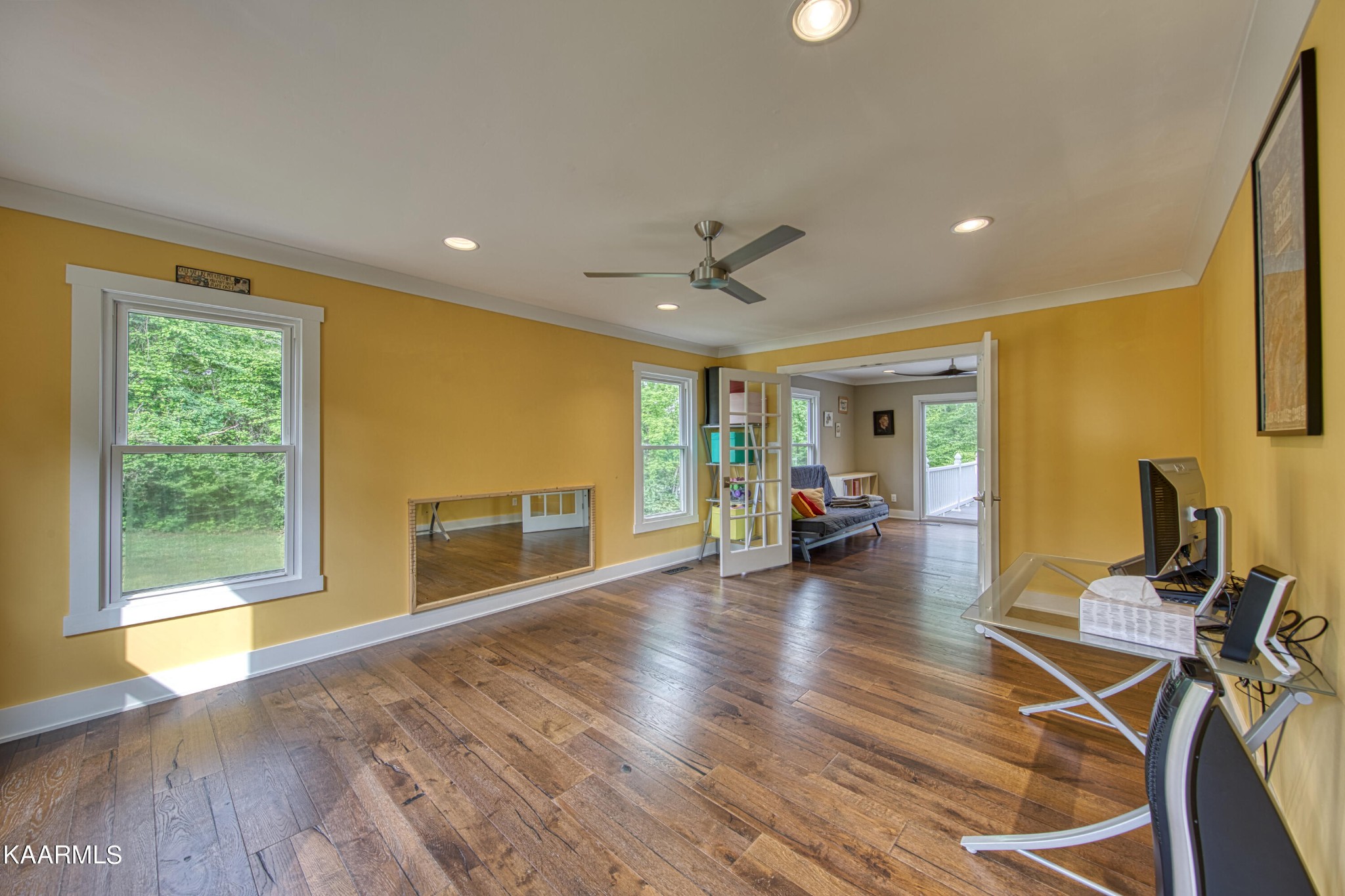 2313 Tooles Bend Road Knoxville, TN 37922 - Photo 24 of 50 a view of a livingroom with furniture hardwood floor and a ceiling fan