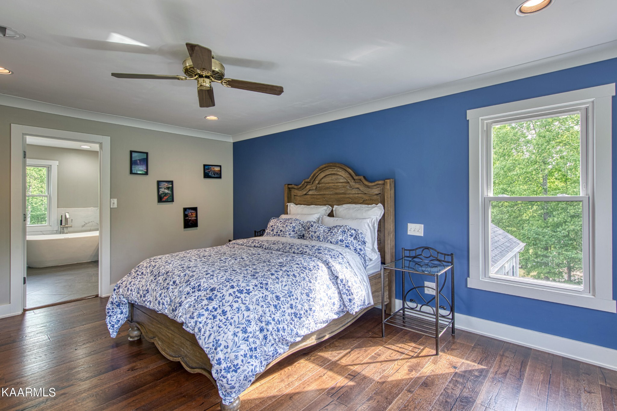 2313 Tooles Bend Road Knoxville, TN 37922 - Photo 30 of 50 a bedroom with a bed and wooden floor