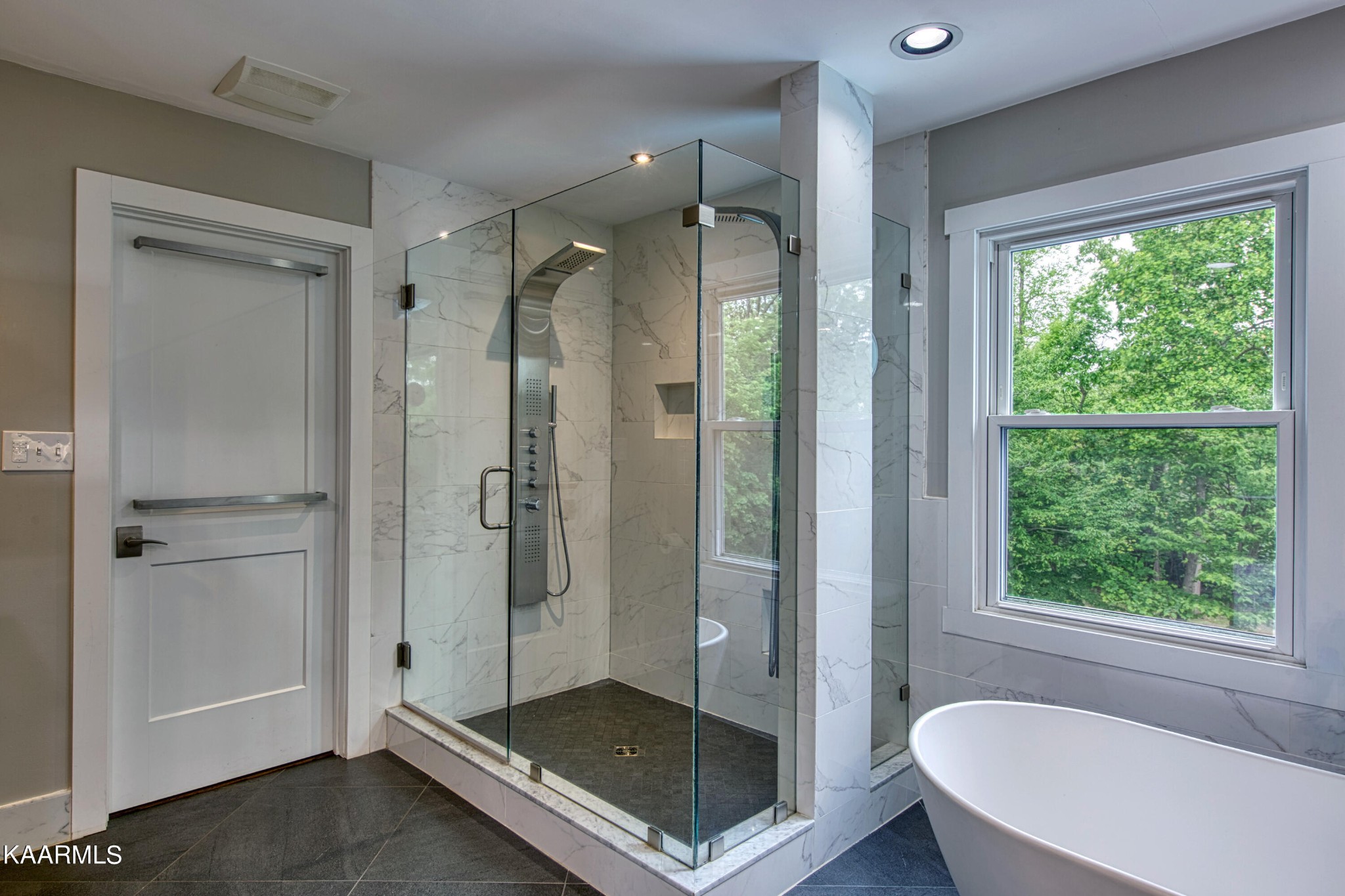 2313 Tooles Bend Road Knoxville, TN 37922 - Photo 33 of 50 a bathroom with a glass shower door and a window