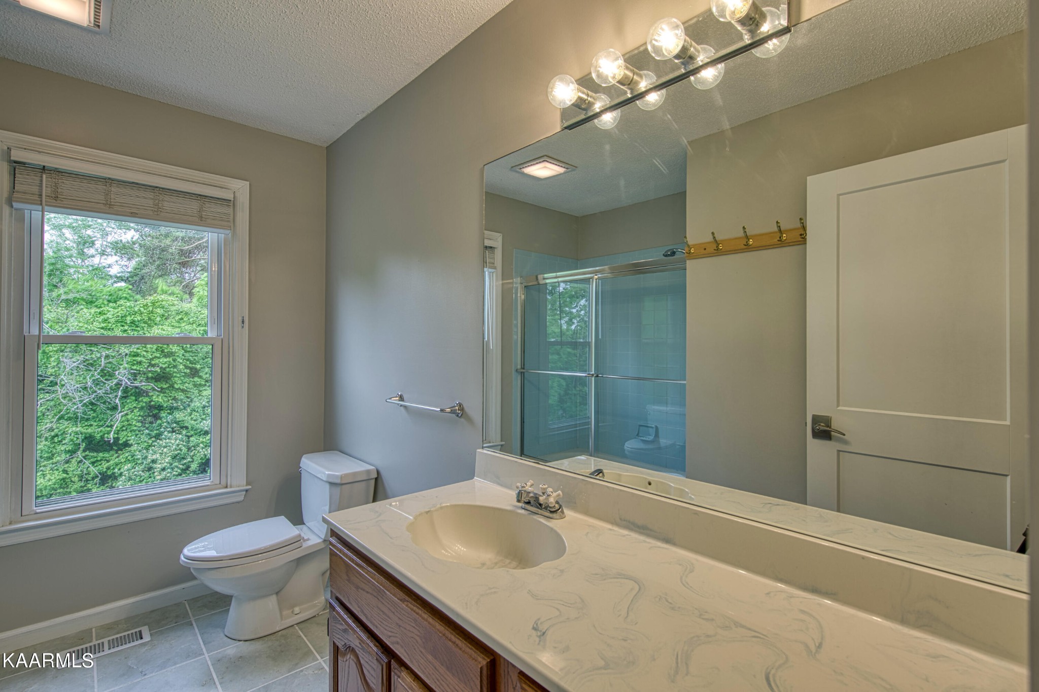 2313 Tooles Bend Road Knoxville, TN 37922 - Photo 37 of 50 a bathroom with a sink a toilet and shower