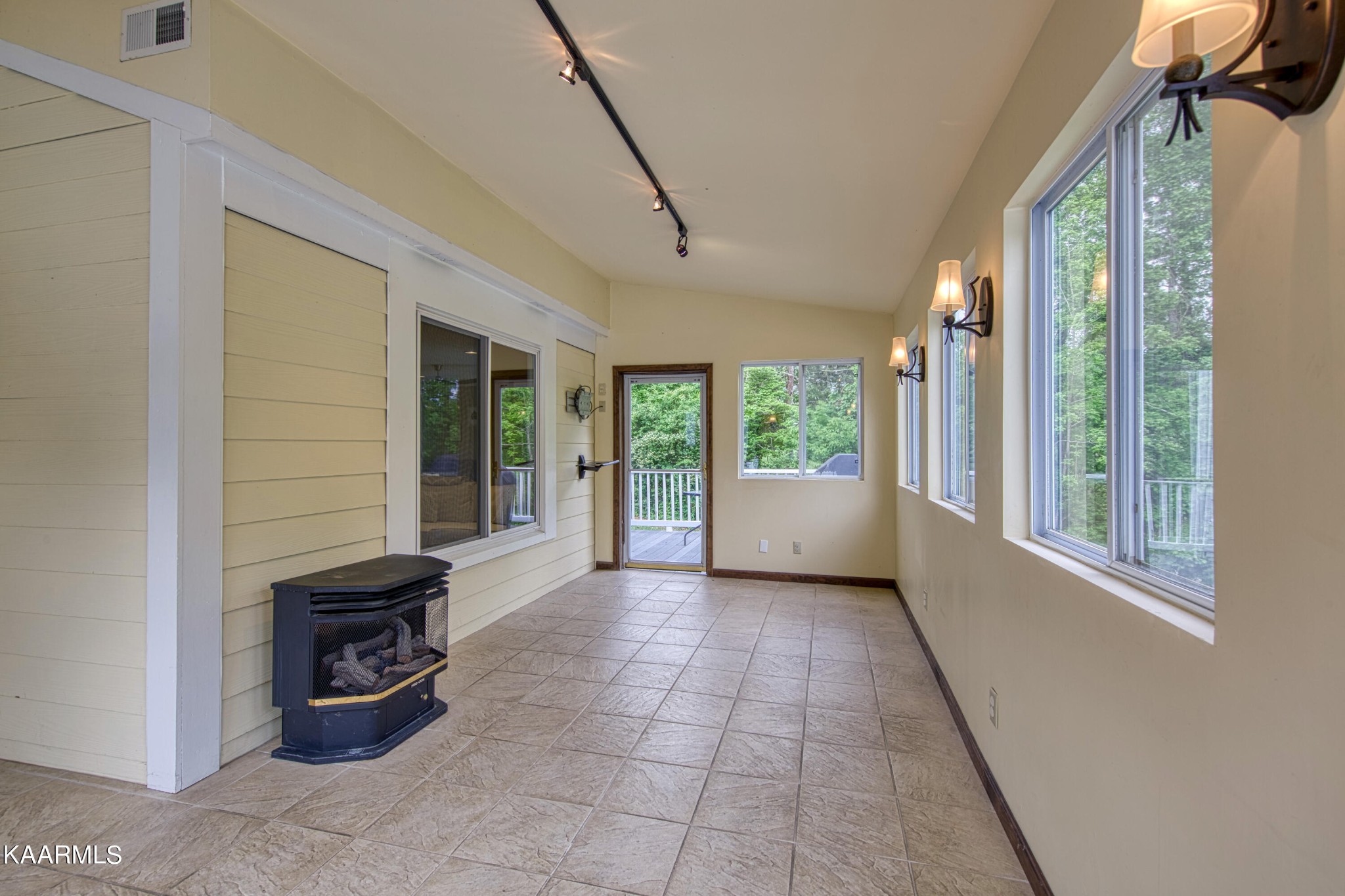 2313 Tooles Bend Road Knoxville, TN 37922 - Photo 40 of 50 a view of a porch with a floor to ceiling window and potted plants